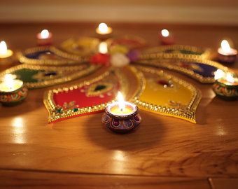 Decorate table top with rangoli