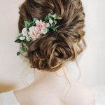 5 Ways to style a bun with floral accessories Bun hairstyle with flower arrangement