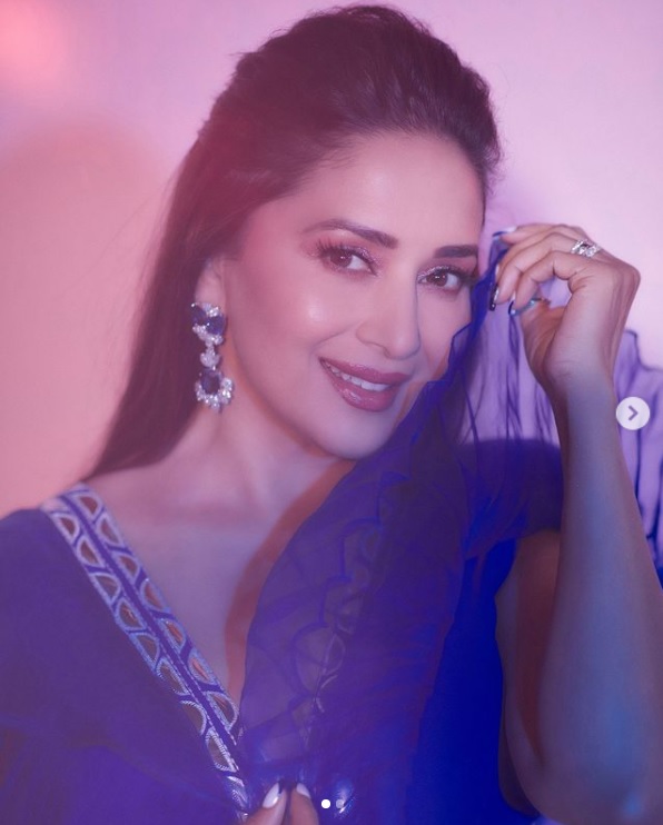 Madhuri Dixit looks surreal in a blue modern top and embroidered skirt