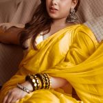 Top Colour Trends In India 2026 – What To Wear This Season? Woman in mustard yellow saree in summer 2026